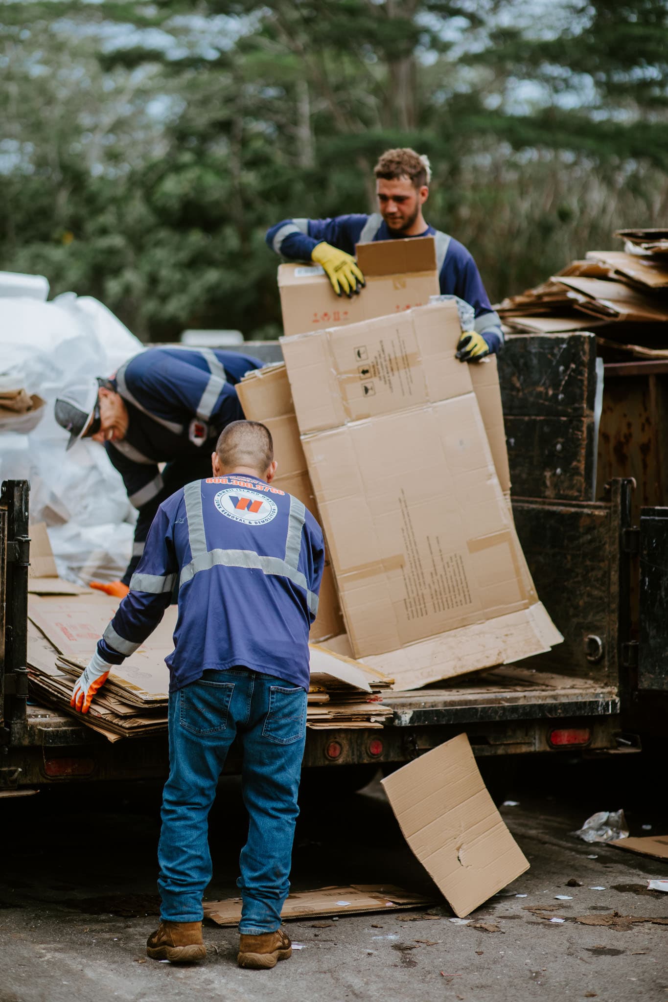 Hawaii Island Waste crew loading materials